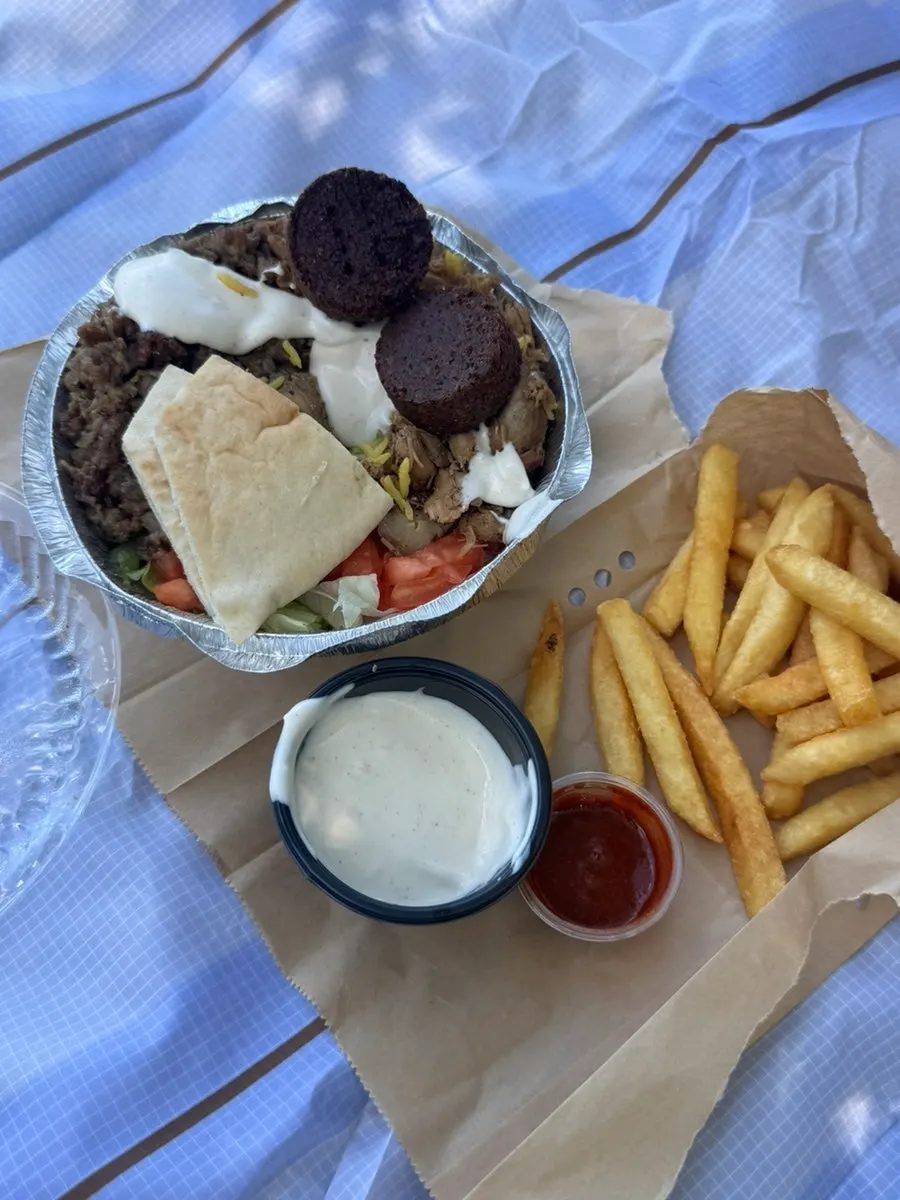 Combo Platter generously drizzled with white sauce