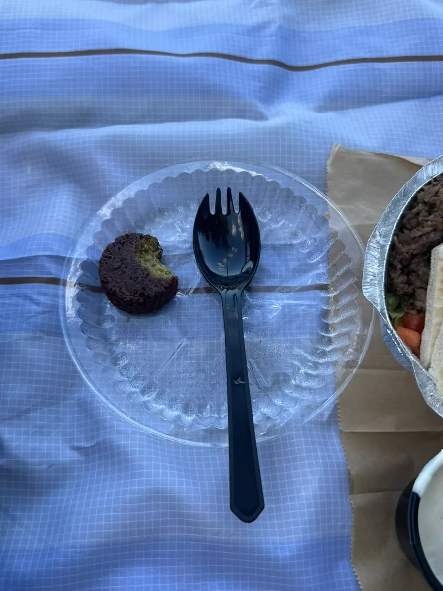 A bite of the optional added falafel