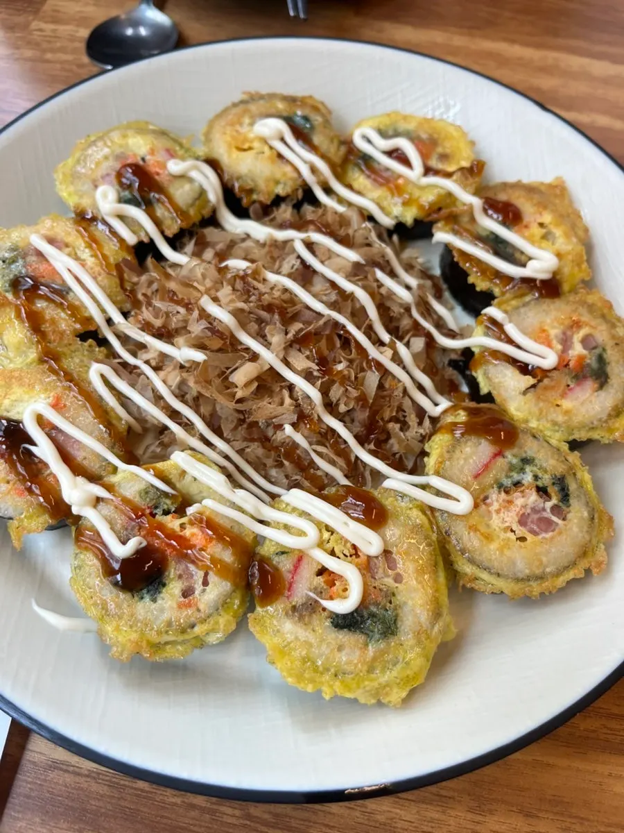 A plate of egg-coated, pan-fried gimbap-jeon
