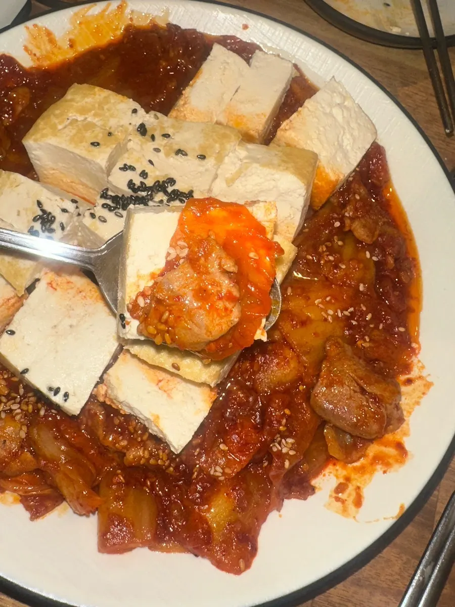 A scoop of stir-fried kimchi with meat