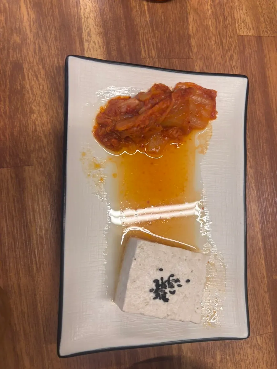 Plate of half-eaten tofu kimchi