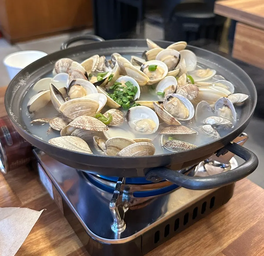 A pot piled high with mountain-high clam soup