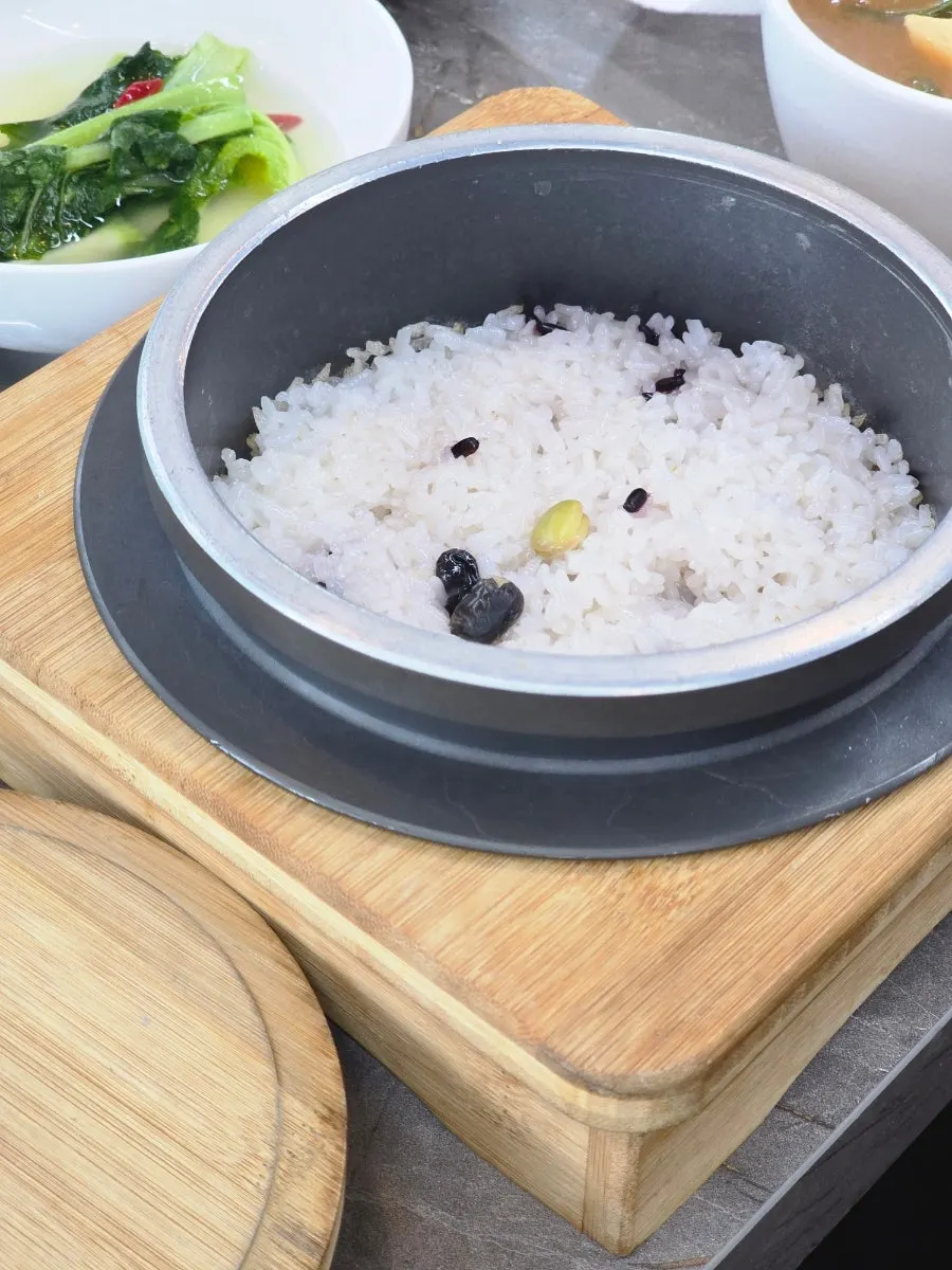 Side dishes of seasoned greens and braised dishes