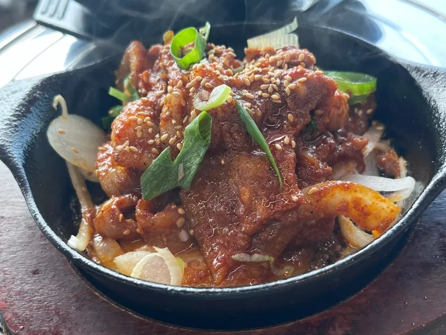 Spicy pork stir-fry with smoky fire flavor
