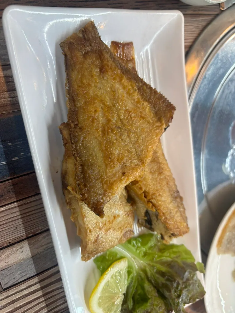 Plate of golden grilled fish