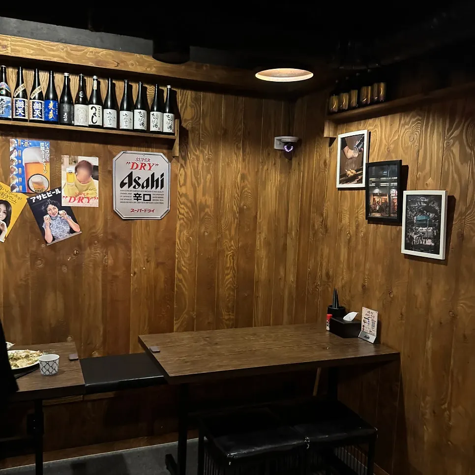 Wall covered in retro Japanese liquor ad posters