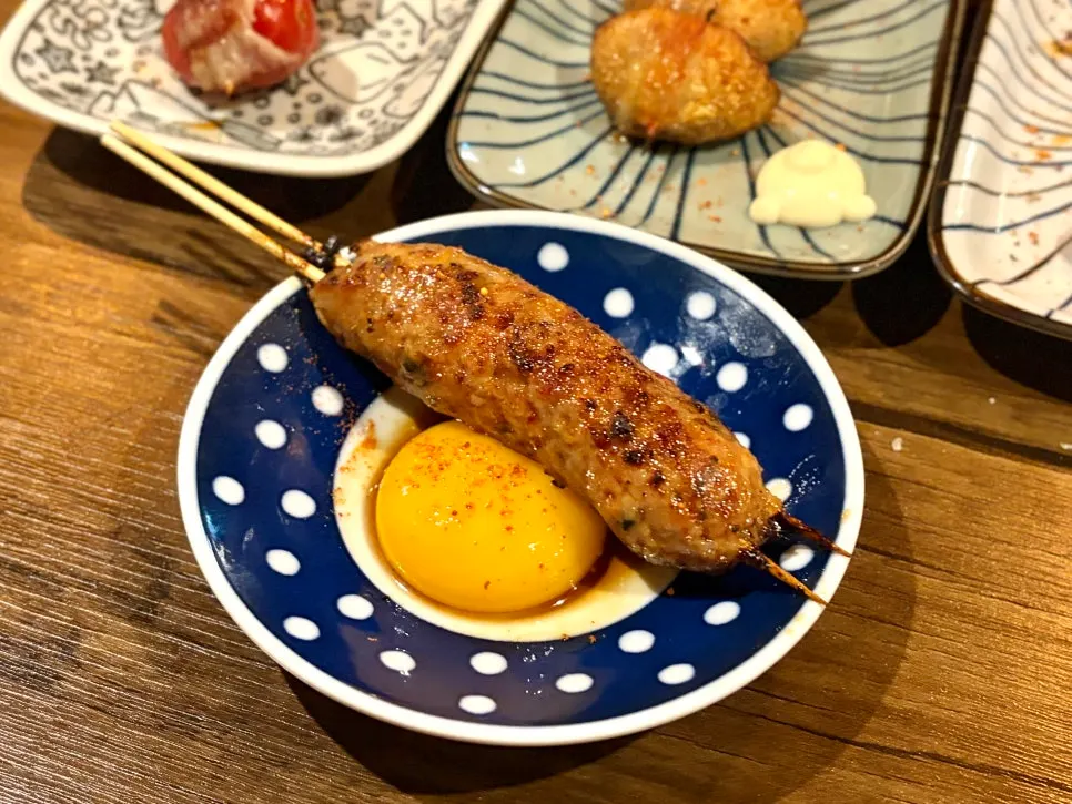Tsukune served with an egg yolk