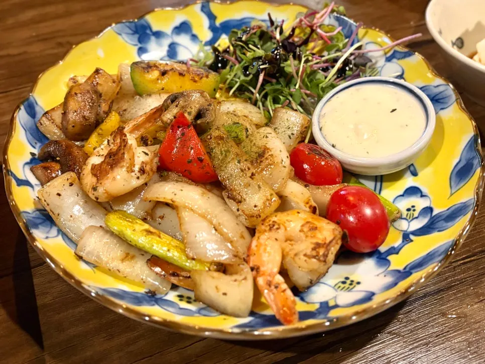 A plate of buttered shrimp and scallops