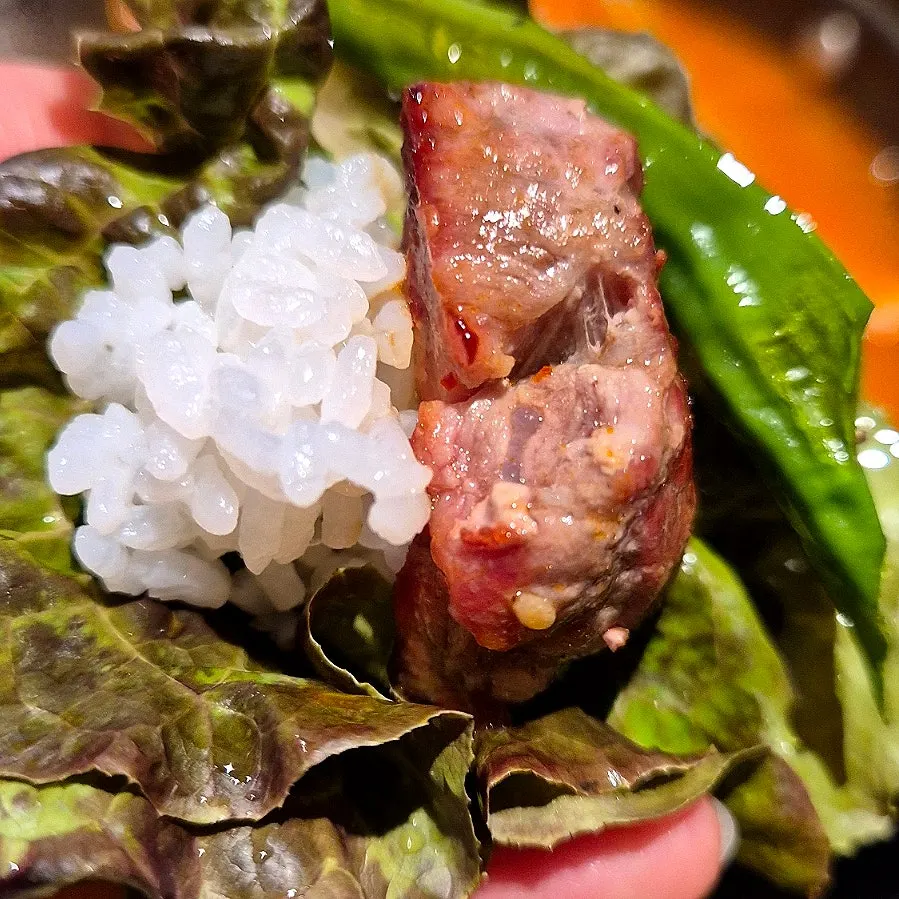 A full black pork spread at a window table