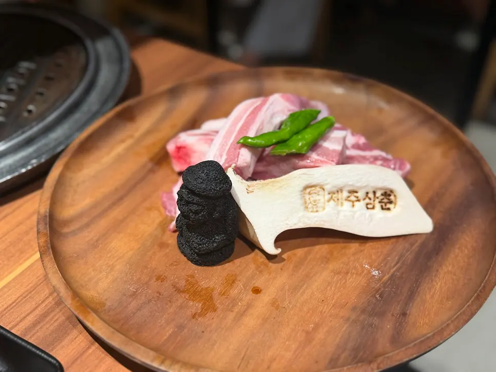 Black pork plated with grapevine smoking chips
