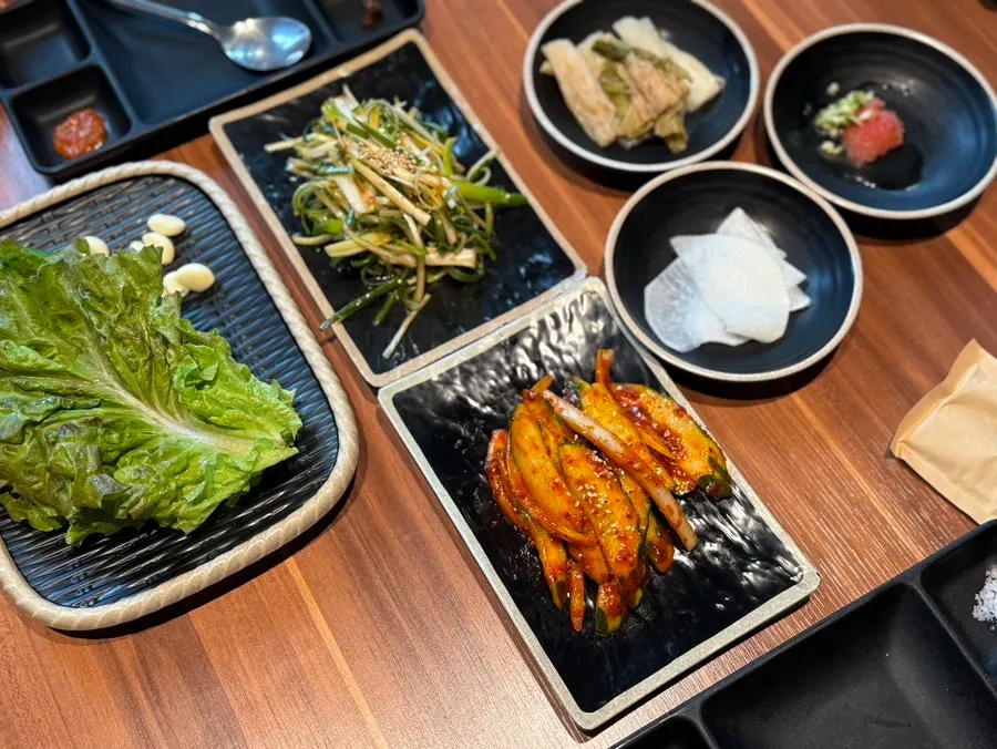Staff grilling aged black pork
