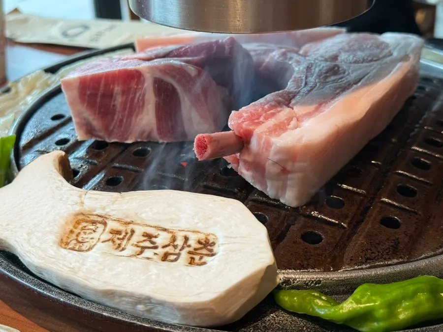 Various sauces served with black pork