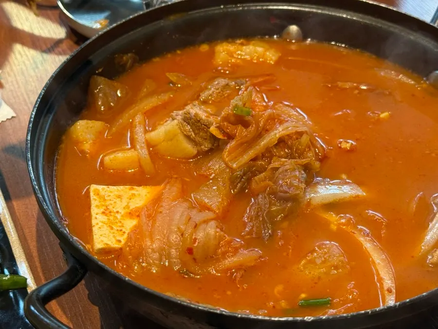 Tender black pork enjoyed with a child