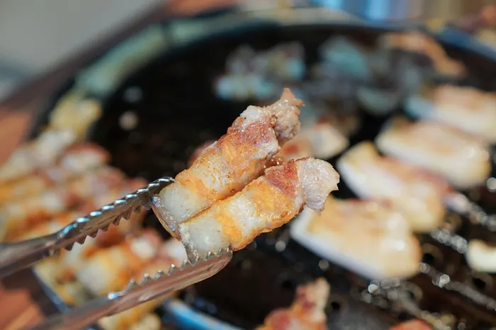 Aged kimchi grilled around the edge of the grill