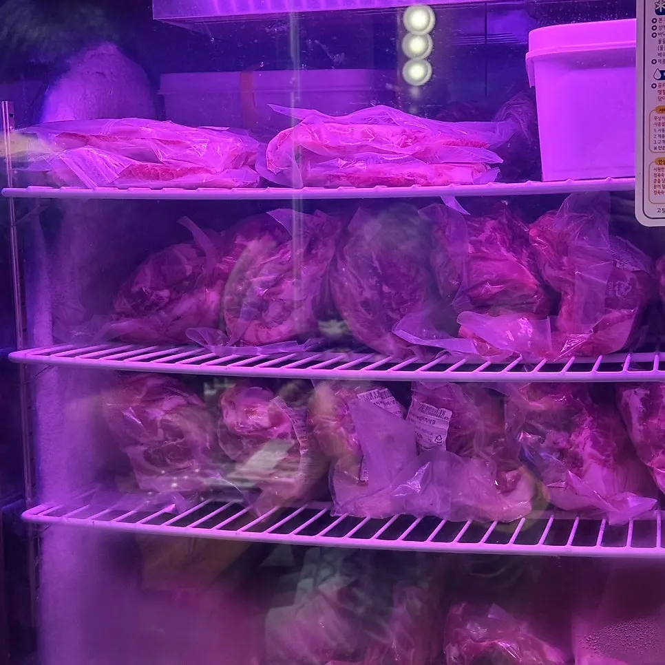 Low-temperature aging fridge for black pork on one side of the restaurant