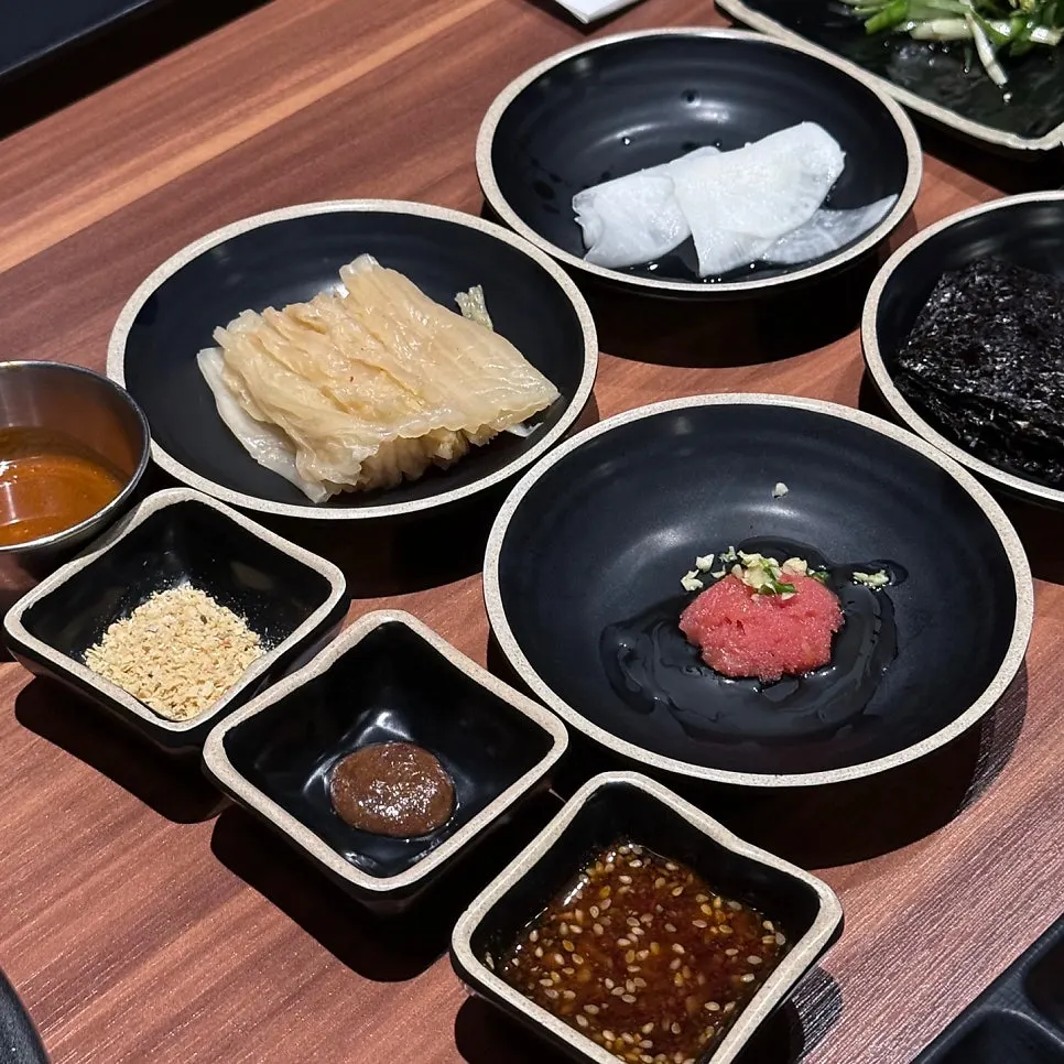 Jeju Samchun basic side dish spread including pollack roe