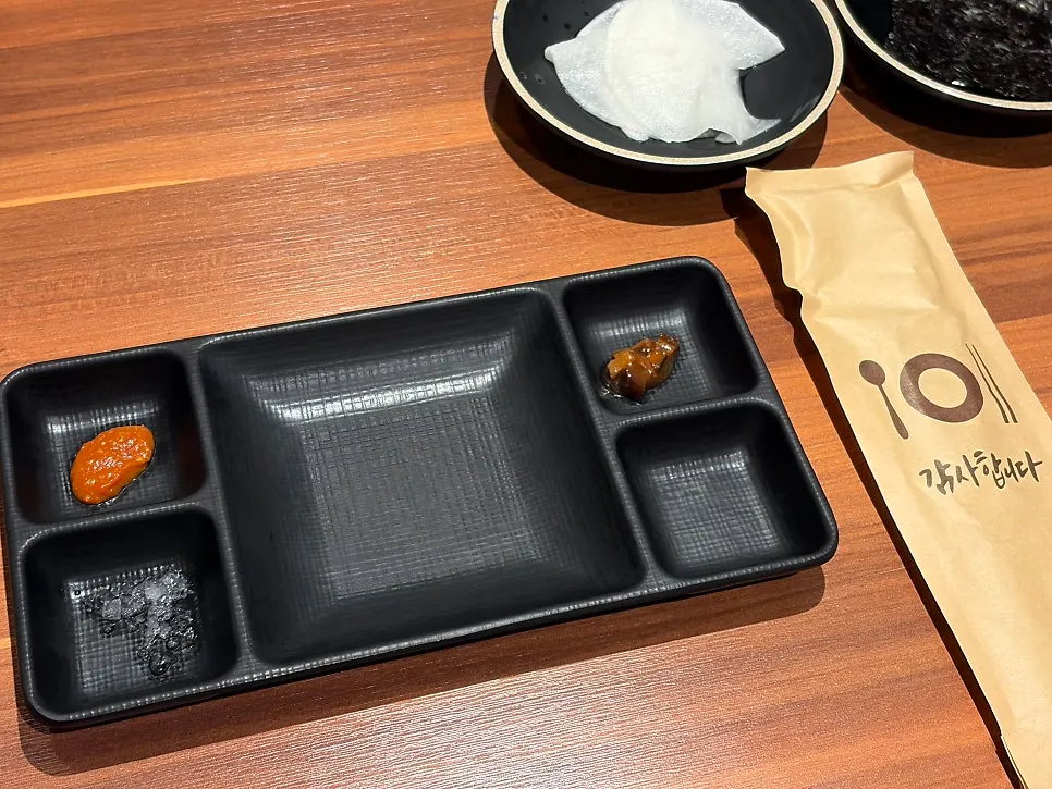 Breadcrumb salt served alongside black pork