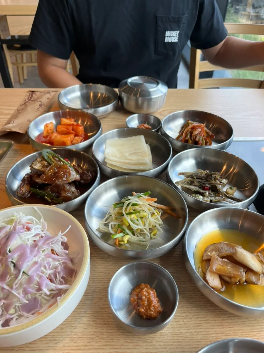 Table spread with kimchi and various side dishes
