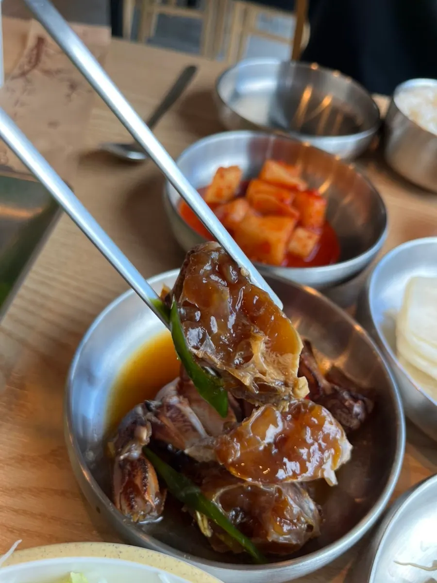 Menu listing braised hairtail, black pork duruchigi, and more