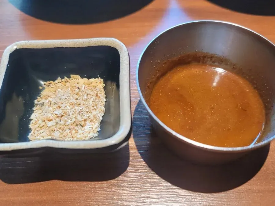 Myeongnan and garlic soy sauce among Jeju Samchun's seasoning setup