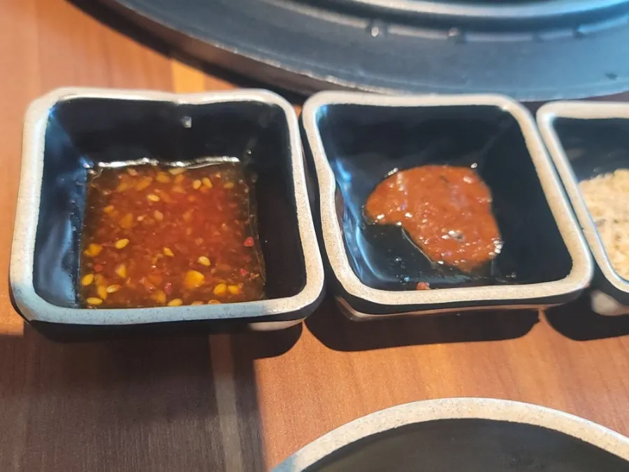 Breadcrumb salt and myeoljeot placed on a sauce plate