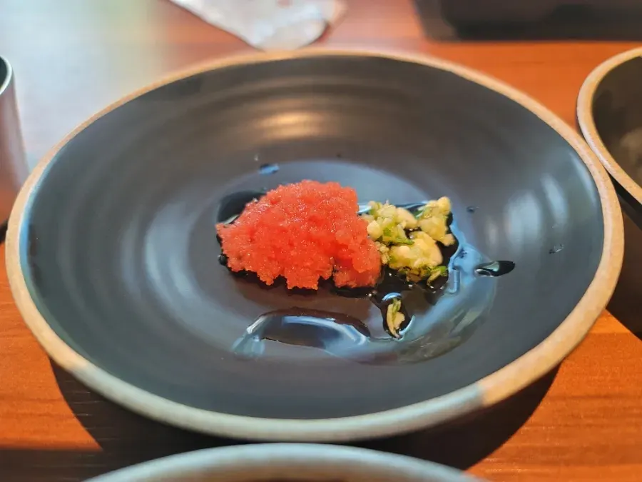 Close-up of sauces and side dishes to pair with the meat