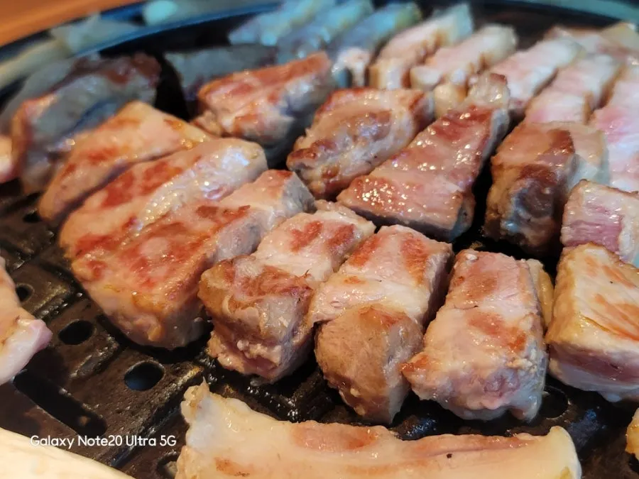 Myeongnan gimssam with meat and pollock roe on seaweed