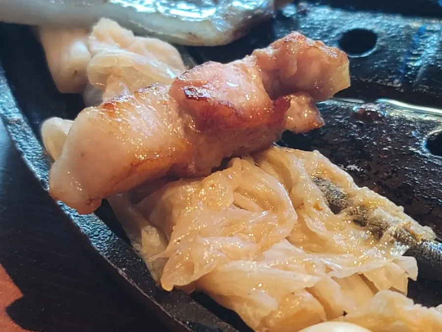 Staff-grilled piece of pork neck cooked to the right doneness