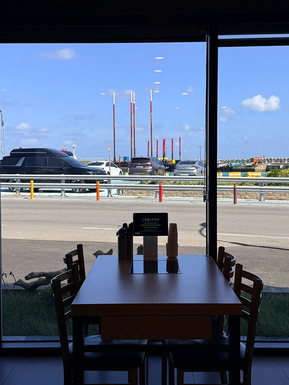 Ocean view of Hamdeok visible from inside the restaurant