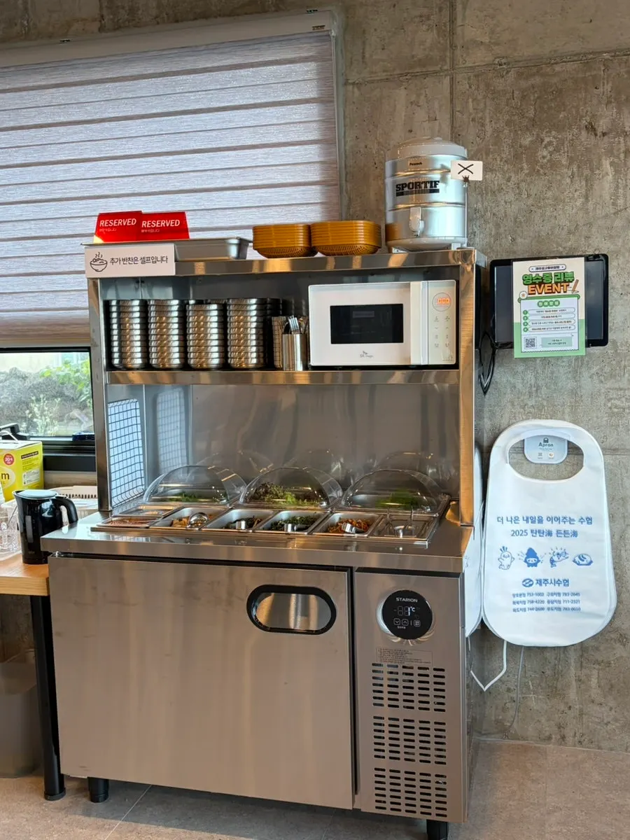 Self-serve bar with extra side dishes, wraps, and aprons