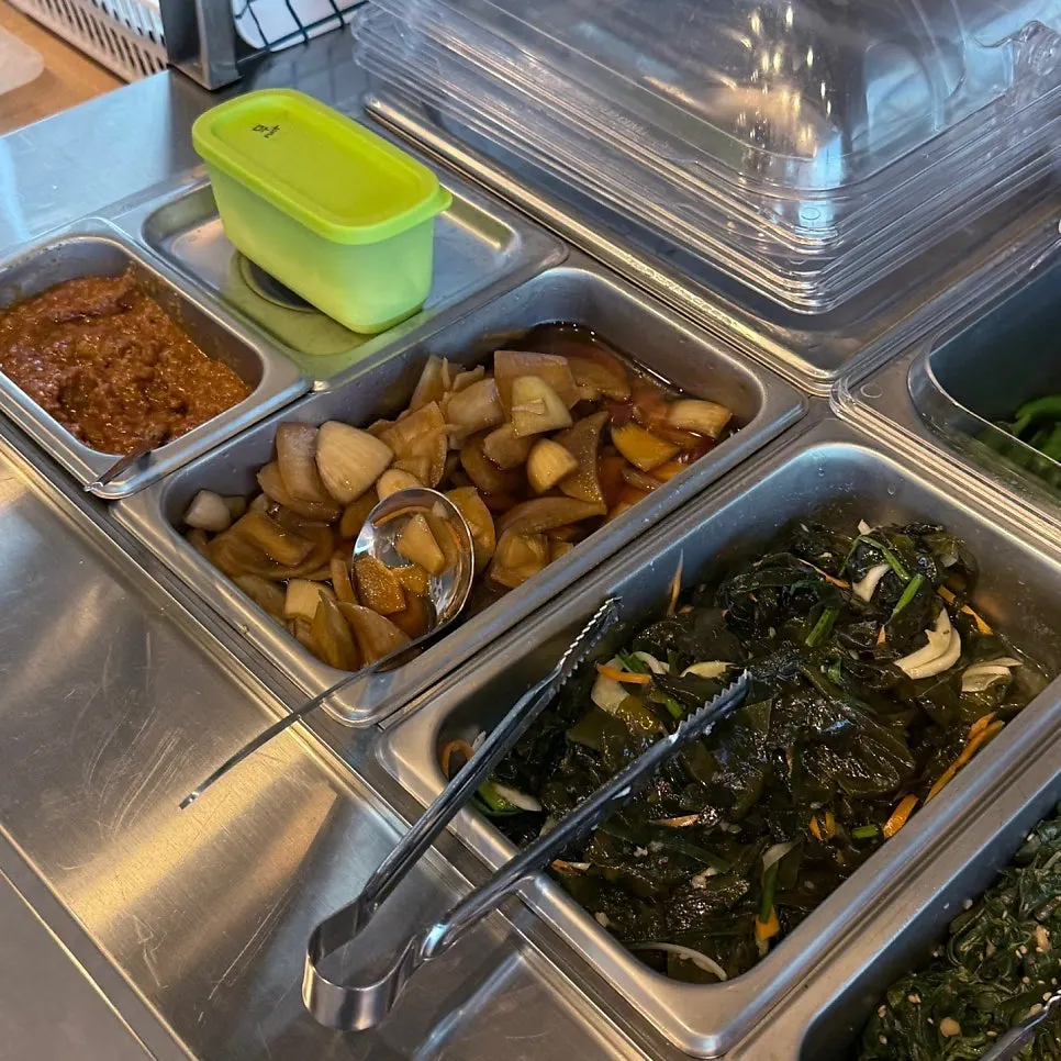 Self-serve bar fully stocked with side dishes