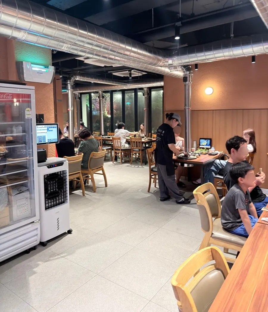 Restaurant interior with family diners