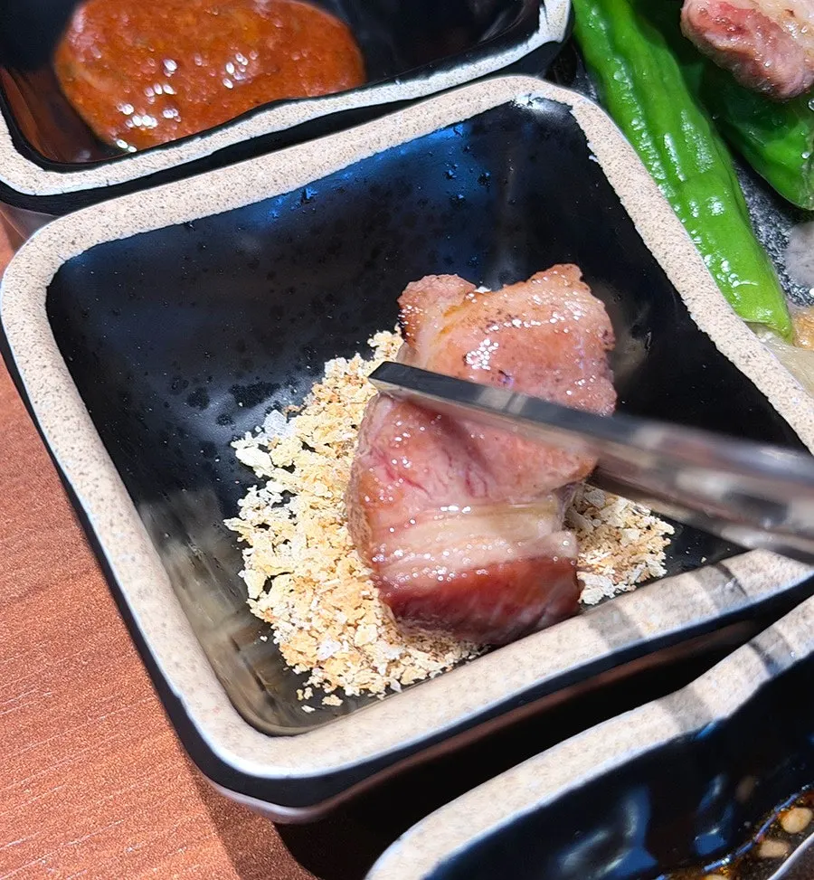 Black pork with side dishes and sauces