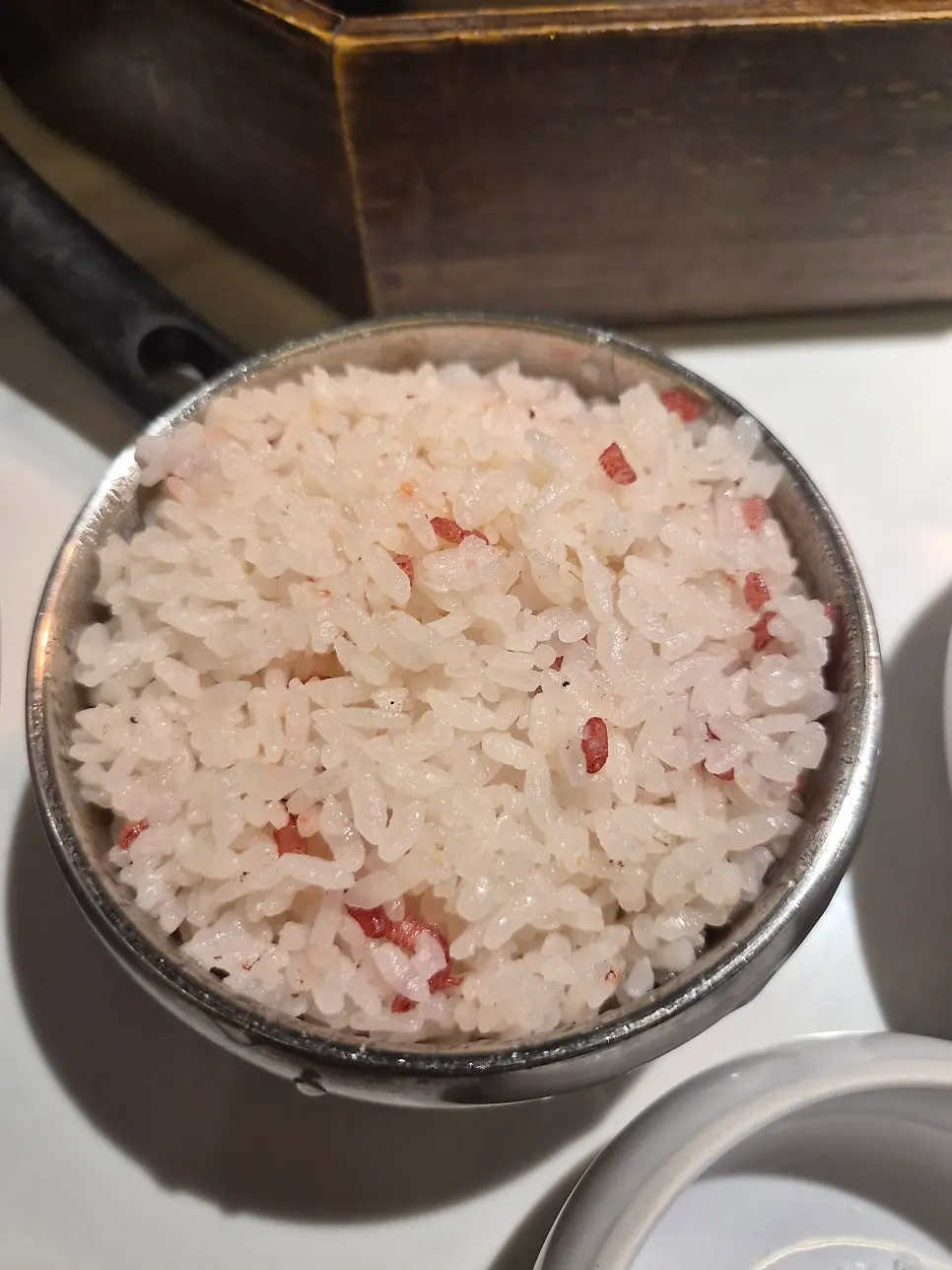 A bowl of reddish red yeast rice