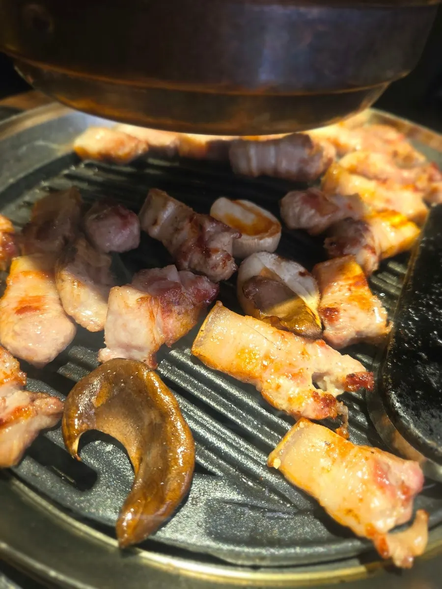 A finished, thick piece of grilled pork belly