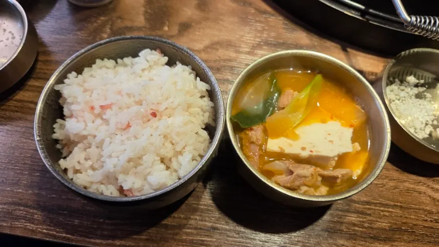 Pot of Hamdon's doenjang jeongol with a whole block of tofu on top
