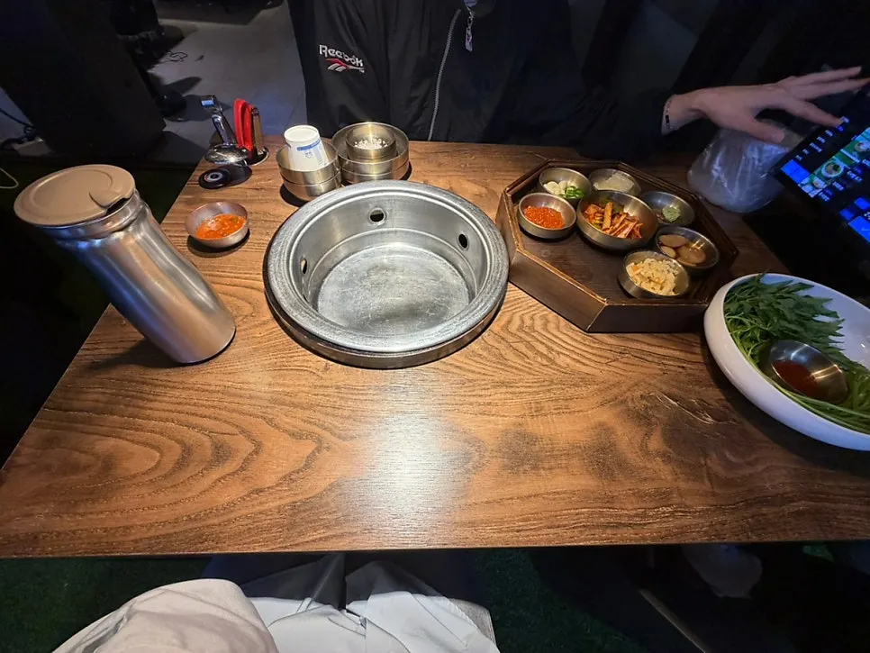 Table set with water, basic side dishes, and small plates