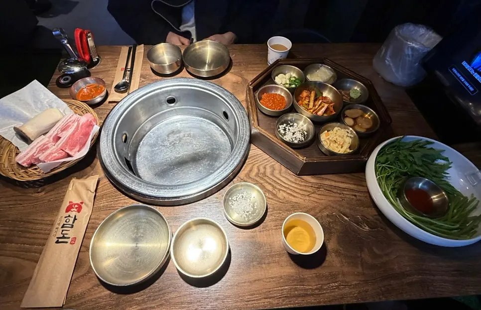 Full table spread with meat and side dishes