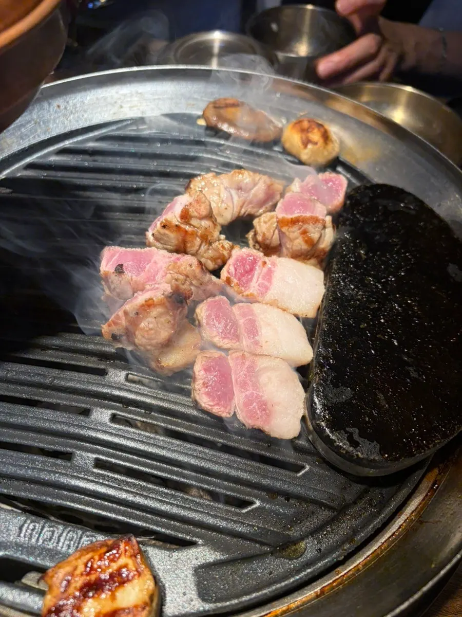 Plate with grilled minari and pork belly together