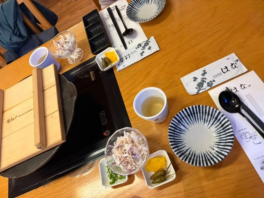 Table setting with salad and side dishes laid out