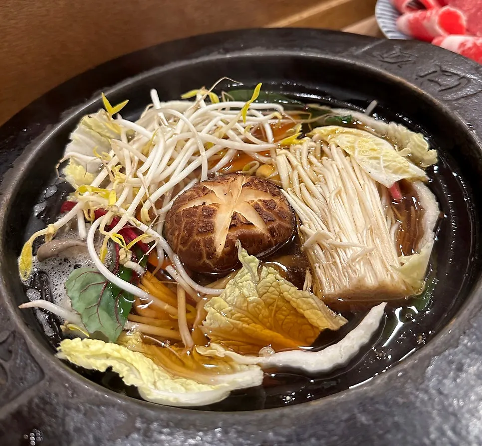 Vegetables being cooked in the broth
