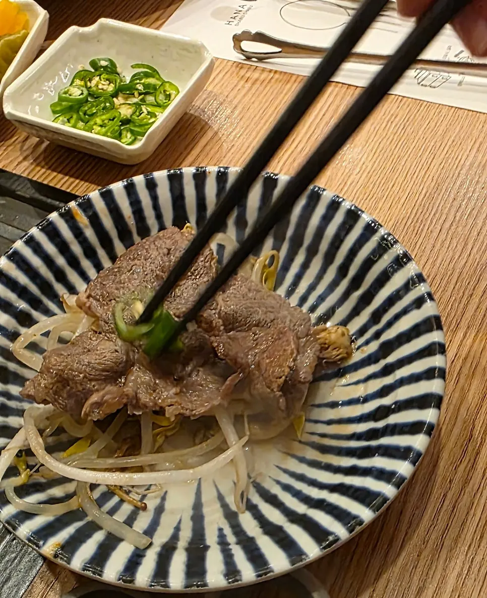 Shabu-shabu broth simmering in a cast-iron pot