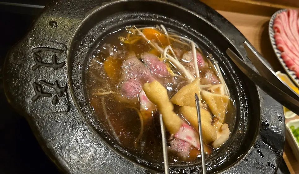 Beef cooking in the shabu-shabu broth