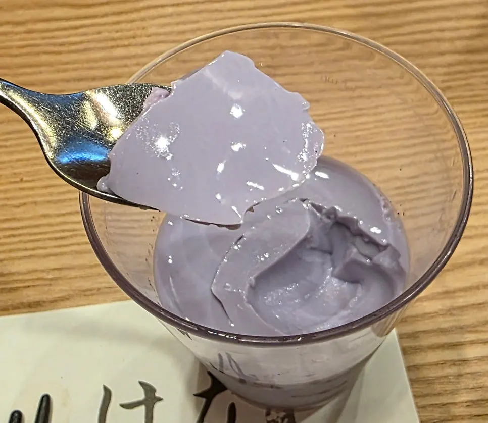 A bowl of ube pudding enjoyed to finish the meal