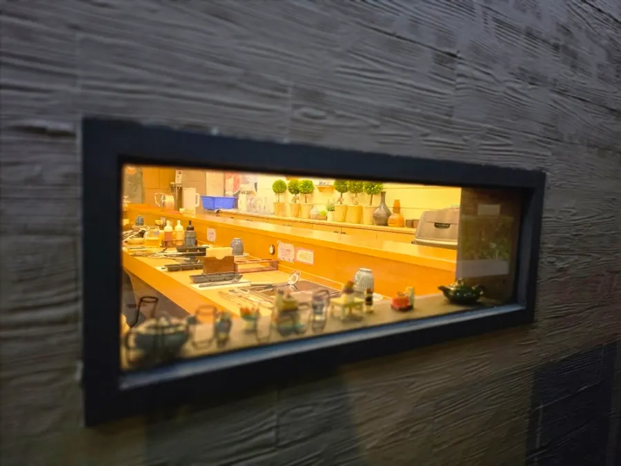 Window at Hana Shabu Shabu glowing with warm light