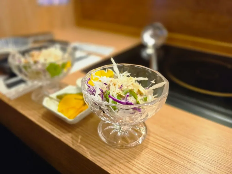 Green salad topped with sesame dressing