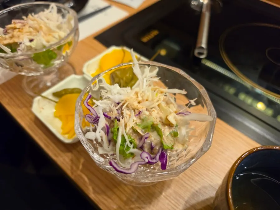 Close-up of the green salad served before the meal