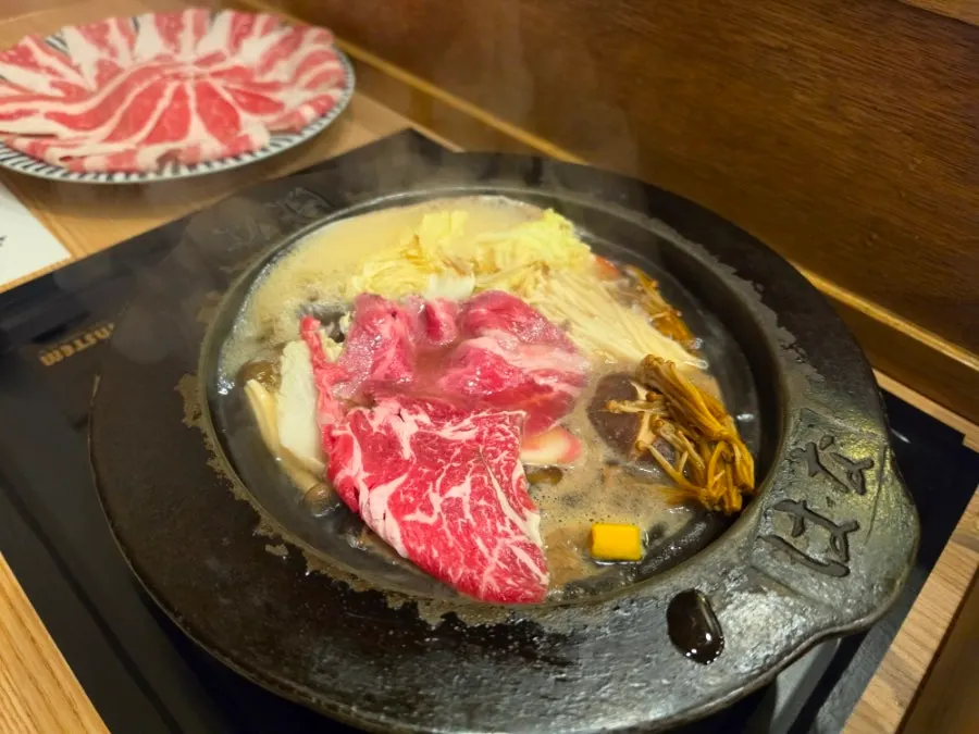 Meat being cooked in the broth