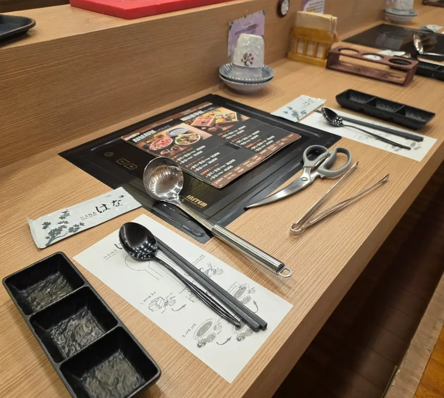 Table set for two with the dinner brisket and sirloin shabu-shabu order