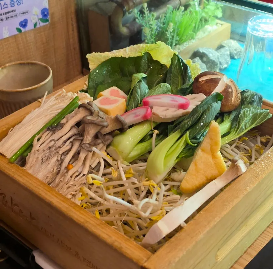 Pot of shabu-shabu broth set on the tabletop hot pot